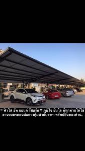 a group of cars parked in a parking lot at Fasai hut and resort in Ban Ko