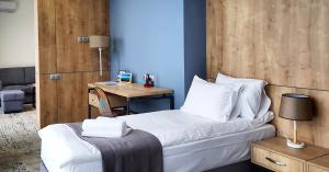 Voodi või voodid majutusasutuse Hotel Alpha toas
