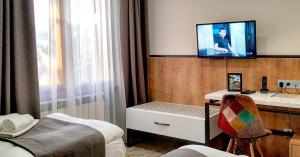 Voodi või voodid majutusasutuse Hotel Alpha toas