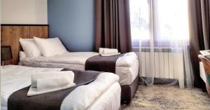 Voodi või voodid majutusasutuse Hotel Alpha toas