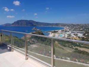 a view of the ocean from the balcony of a house at Panorama Studios in Kefalos