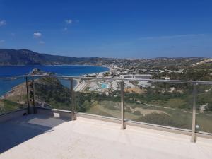 a view of the ocean from the balcony of a house at Panorama Studios in Kefalos