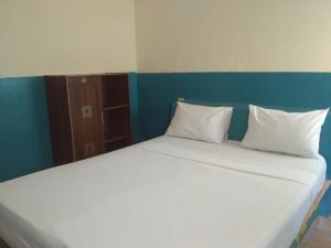 Postel nebo postele na pokoji v ubytování Syifa Homestay