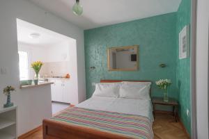 Postel nebo postele na pokoji v ubytování ASTAKOS apartments Budva