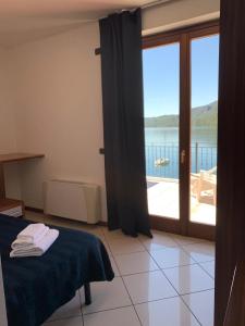 Postel nebo postele na pokoji v ubytování Hotel & Residence La Sibilla Cusiana