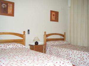 Posteľ alebo postele v izbe v ubytovaní Hostal Muriel