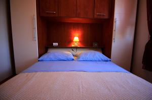 Postel nebo postele na pokoji v ubytování Apartmani Marino
