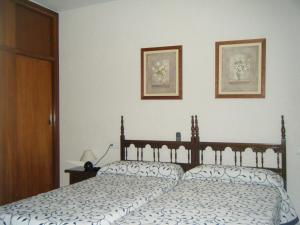 Posteľ alebo postele v izbe v ubytovaní Hostal Muriel