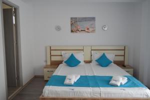 Postel nebo postele na pokoji v ubytování Techirghiol Blue
