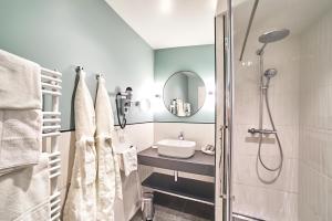 Koupelna v ubytování Le Manoir Hôtel