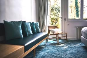Posezení v ubytování Le Manoir Hôtel