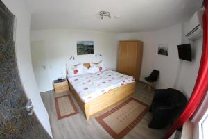 Postel nebo postele na pokoji v ubytování Ferienwohnungen und Appartements - Haus Budinger