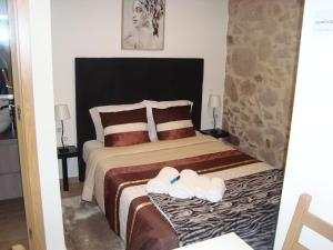 Postel nebo postele na pokoji v ubytování Quinta do Sobrado