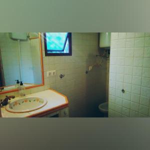 a bathroom with a sink and a mirror at Las Solanas del Pilar in Córdoba