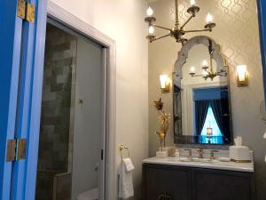a bathroom with a sink and a mirror at The William Boerne in Boerne