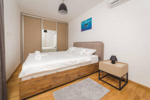Postel nebo postele na pokoji v ubytování Blue Marlin Apartments