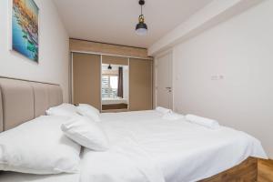 Postel nebo postele na pokoji v ubytování Blue Marlin Apartments