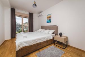 Postel nebo postele na pokoji v ubytování Blue Marlin Apartments