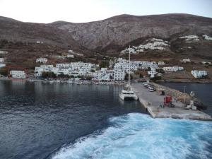a boat is docked at a dock in the water at LARINΑKI'S STUDIO No1 in Amorgos