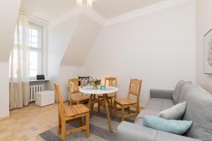 a living room with a couch and a table at Suurkarja Apartment in Tallinn