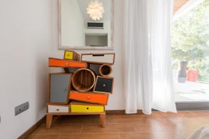 a pile of drawers in a room with a window at Nyumba ya Sun in Cala Tarida