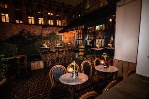a group of tables and chairs in a restaurant at No131 The Promenade in Cheltenham