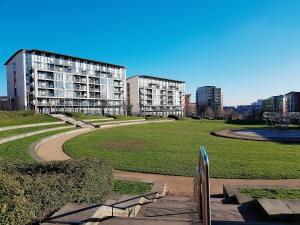 a park with benches and buildings in a city at ParkView City Balcony Apartment with Self Checkin in Birmingham