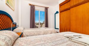 Postel nebo postele na pokoji v ubytování Apartamentos Charlys Can Picafort