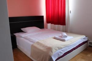 Letto o letti in una camera di Hotel Beograd - Yu