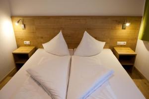 A bed or beds in a room at Apart Corona