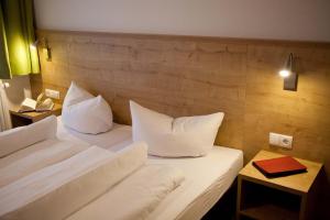 A bed or beds in a room at Apart Corona