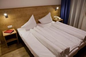 A bed or beds in a room at Apart Corona