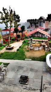 a park with a pavilion and a table and benches at Hotel Galaxy View Tower in Nagarkot