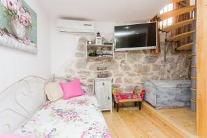 Televízia a/alebo spoločenská miestnosť v ubytovaní House - Apartment Dama