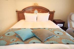 Postel nebo postele na pokoji v ubytování Hotel Coco Grand Kitasenju