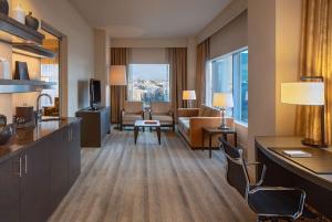 a hotel suite with a living room with a view at Hyatt at Olive 8 in Seattle