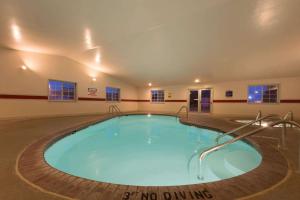 a large swimming pool in a large room at Super 8 by Wyndham Greenfield in Greenfield