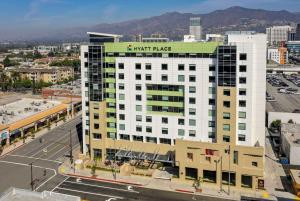 a large white building with a star rate sign on it at Hyatt Place Glendale/Los Angeles in Glendale