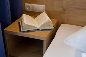 A bed or beds in a room at Apart Corona