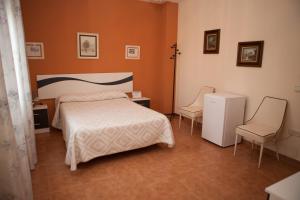 Posteľ alebo postele v izbe v ubytovaní La Rosaleda de Orgaz