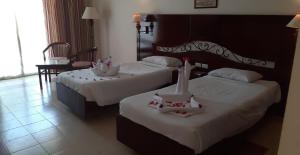 Кровать или кровати в номере Royal Brayka Beach Resort