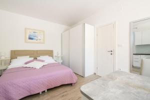 Ένα ή περισσότερα κρεβάτια σε δωμάτιο στο Apartmani Nikola