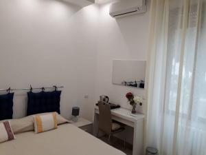 Postel nebo postele na pokoji v ubytování Rosa del Salento