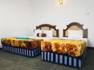 Postel nebo postele na pokoji v ubytování Namadi Nest home stay