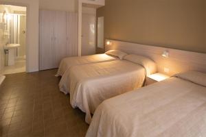 Rúm í herbergi á Hotel Scacciapensieri