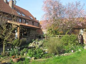 a garden in front of a house at gite air pur in Roisin