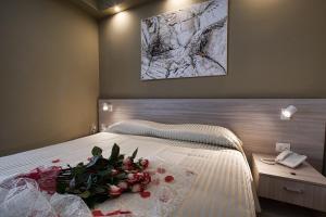 Rúm í herbergi á Hotel Scacciapensieri