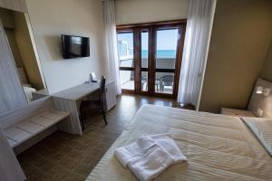 Rúm í herbergi á Hotel Scacciapensieri