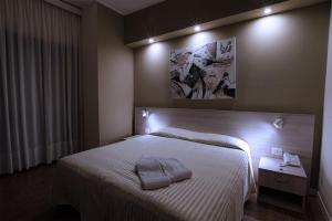 Rúm í herbergi á Hotel Scacciapensieri