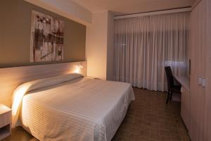Rúm í herbergi á Hotel Scacciapensieri